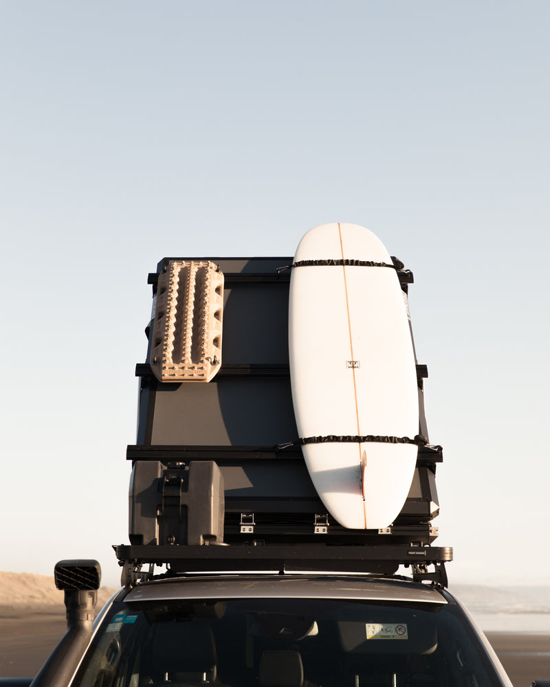 roof top tent and surfboard